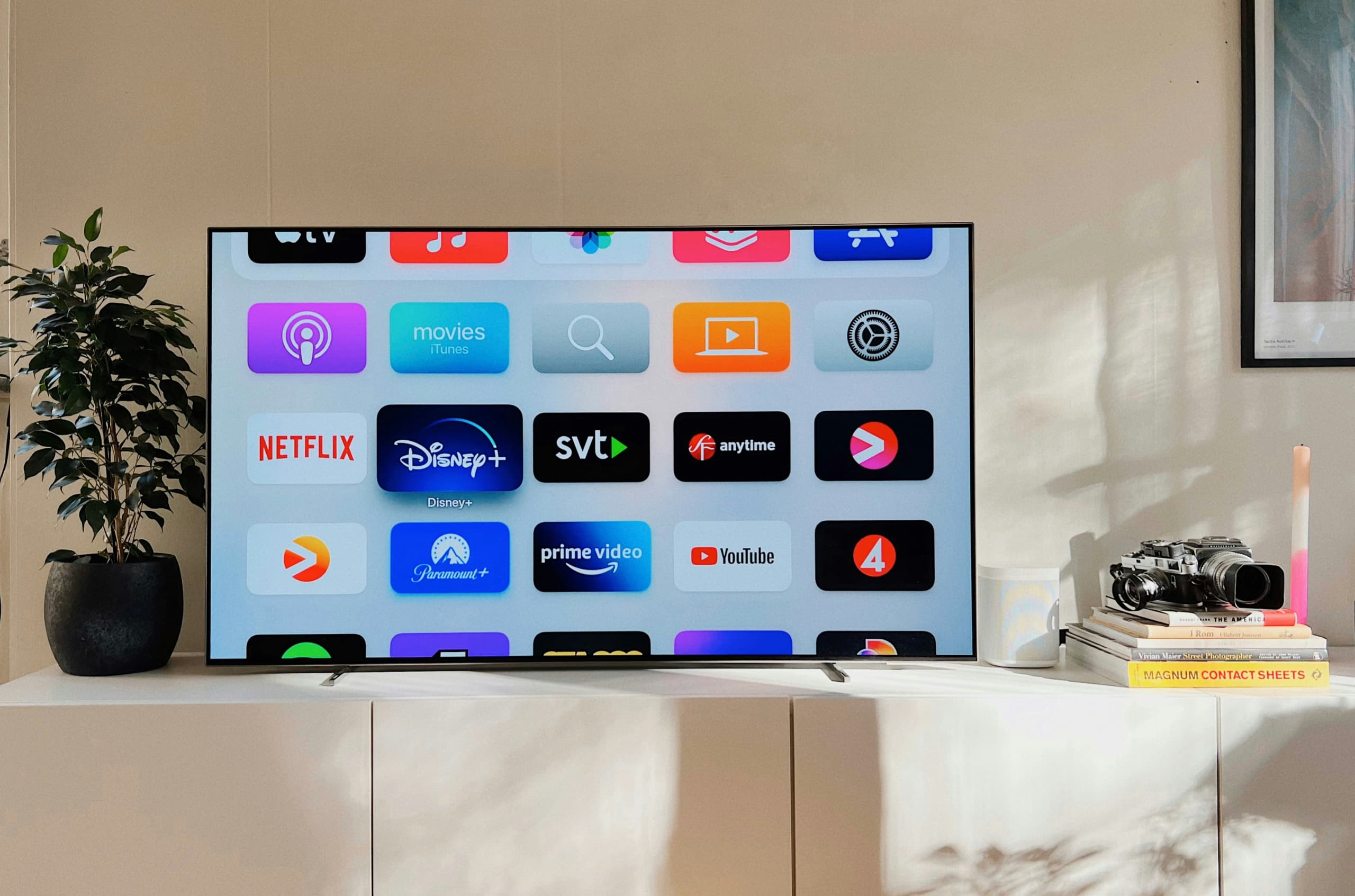 A connected TV sits atop a console in an upscale living room