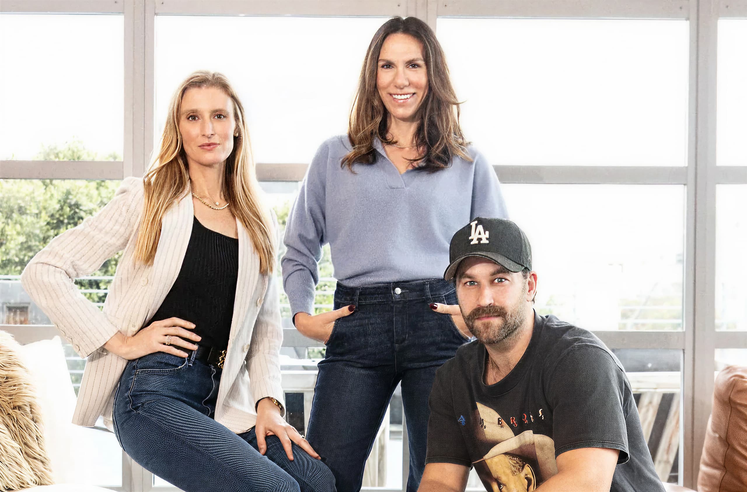 The leadership for Tiny Wins poses in a living room area