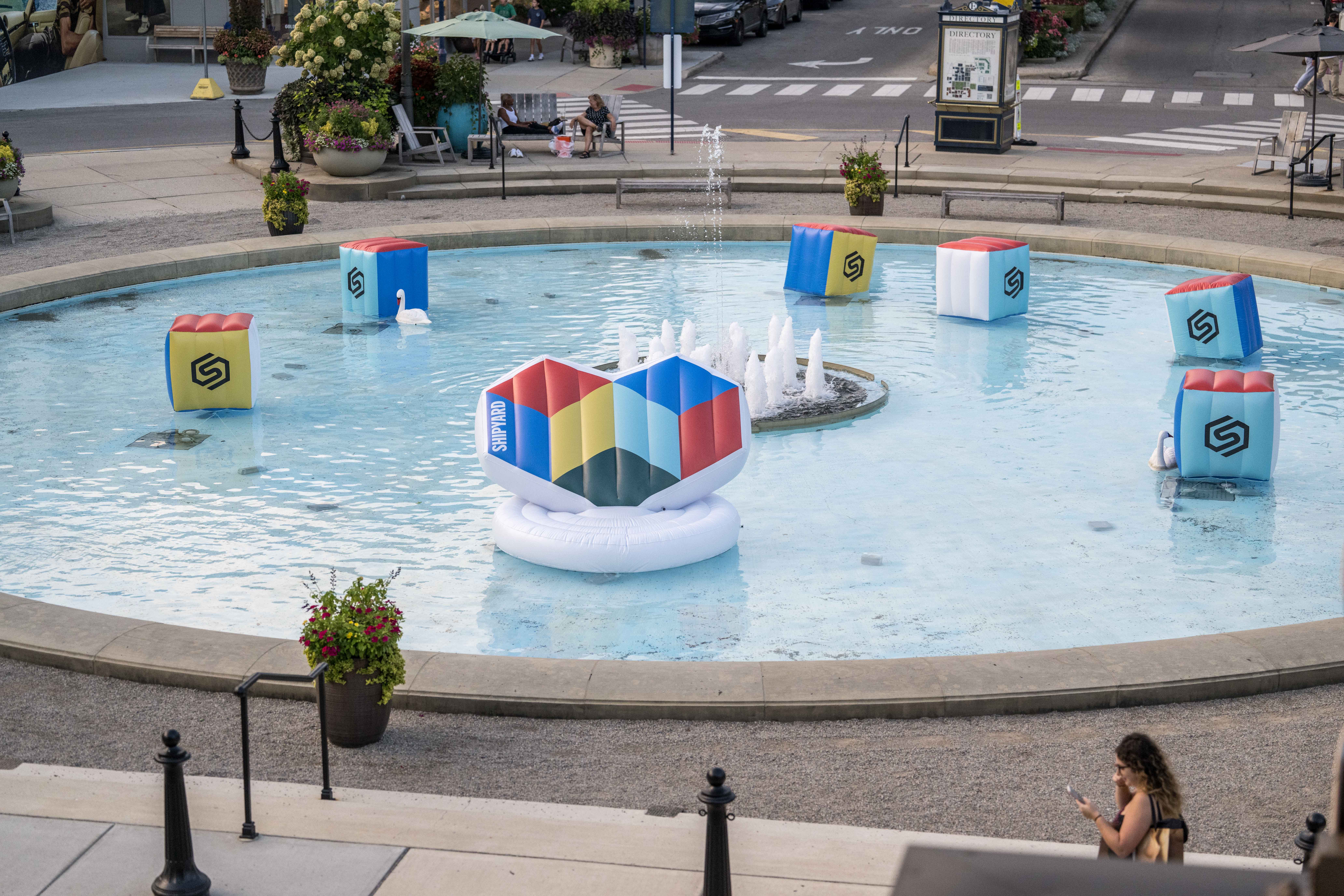 Outdoor fountain with Engineering Brand Love floaties in it