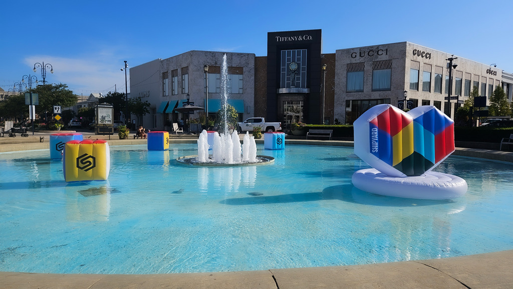 Outdoor fountain with Engineering Brand Love floaties in it